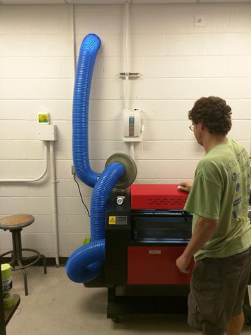 Eli Bridge observes the exhaust ducting of the ne installation