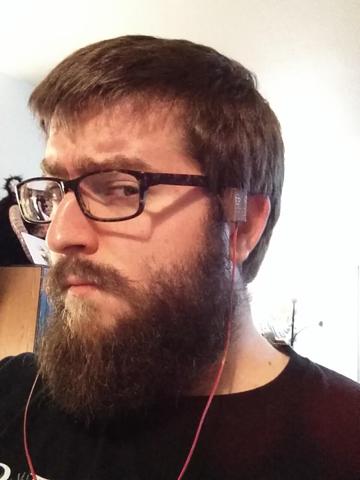 A handsome man with his DIY bone conduction headphones