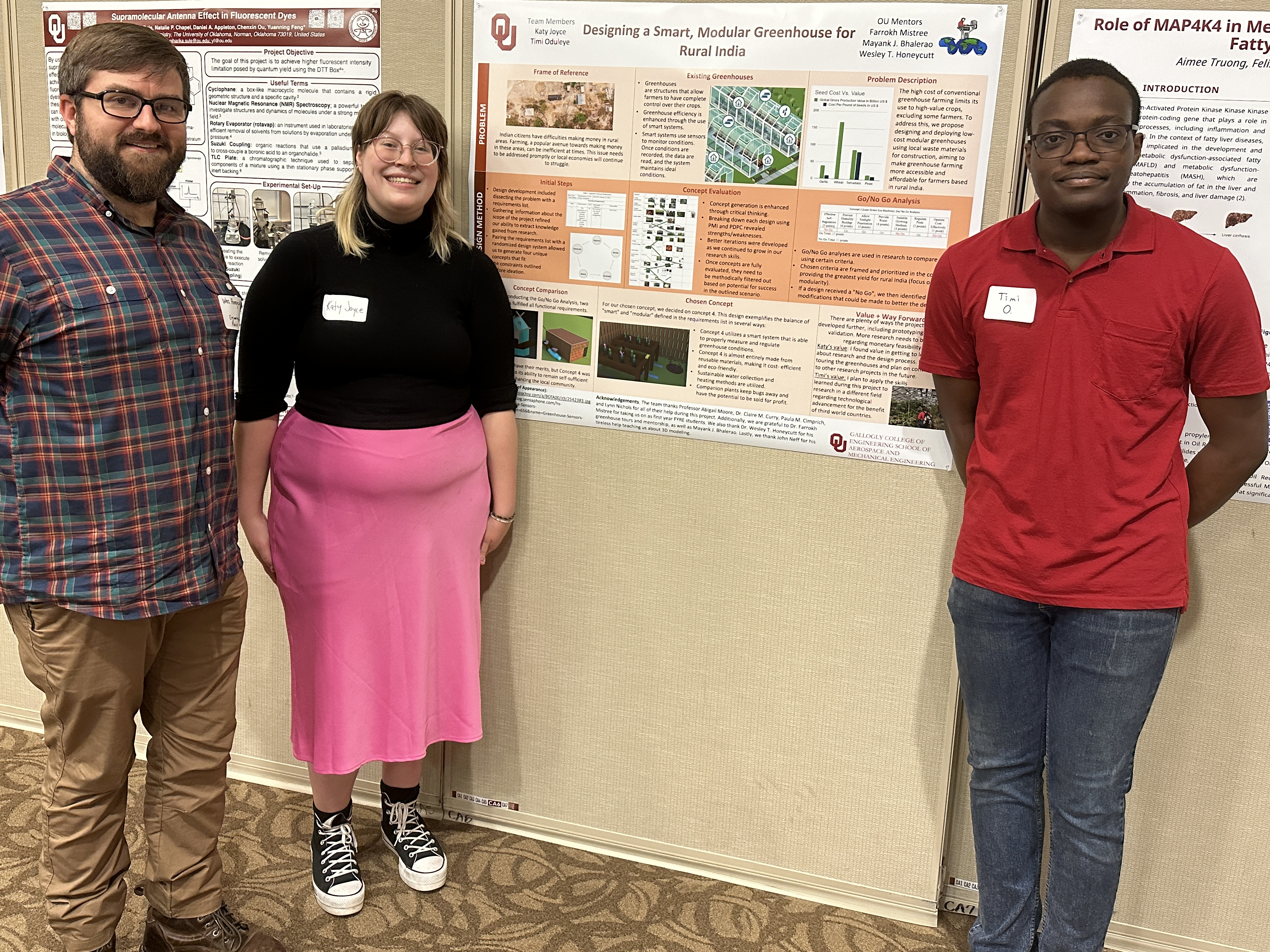 Wes, Katy Joyce, and Timi Oduleye standing in front of their poster.