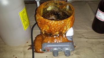 Sugar and metal mixture evaporated over heat and caramelized.