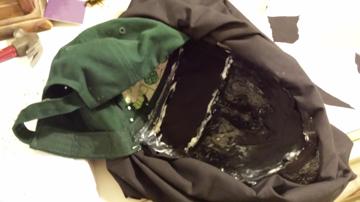 Mask internals showing hat, blackout fabric, and paint